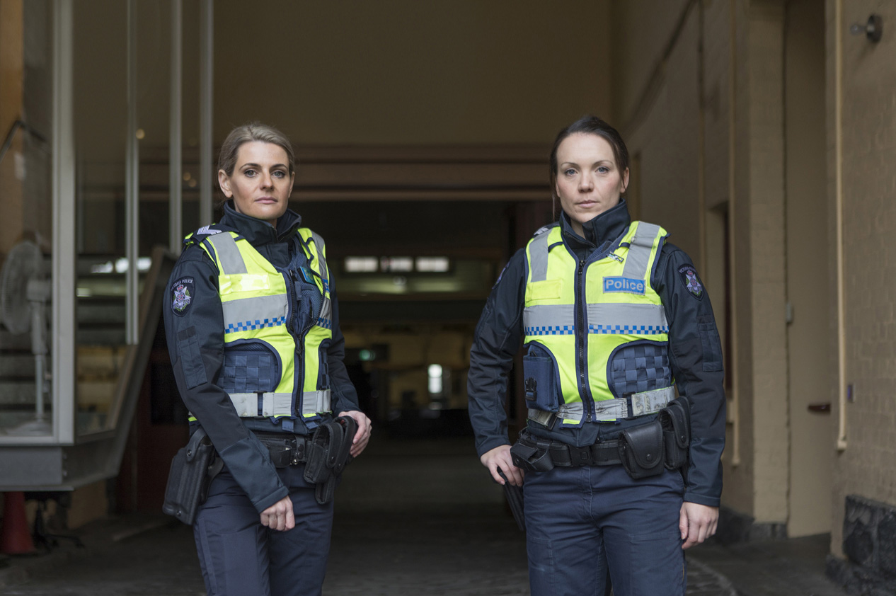 Two female police officers standing